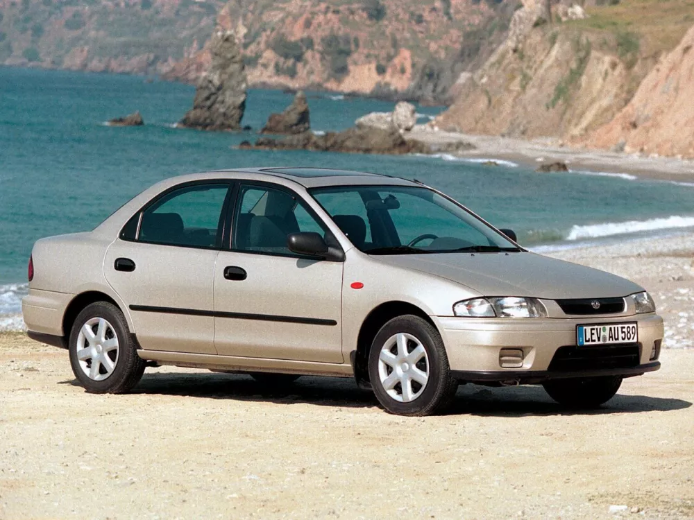 Автомобиль Mazda 323 V (BA) Седан