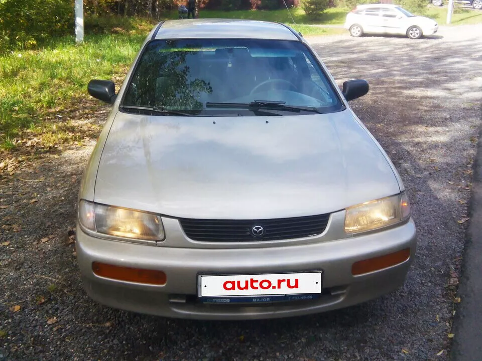 Автомобиль Mazda 323 V (BA) Седан