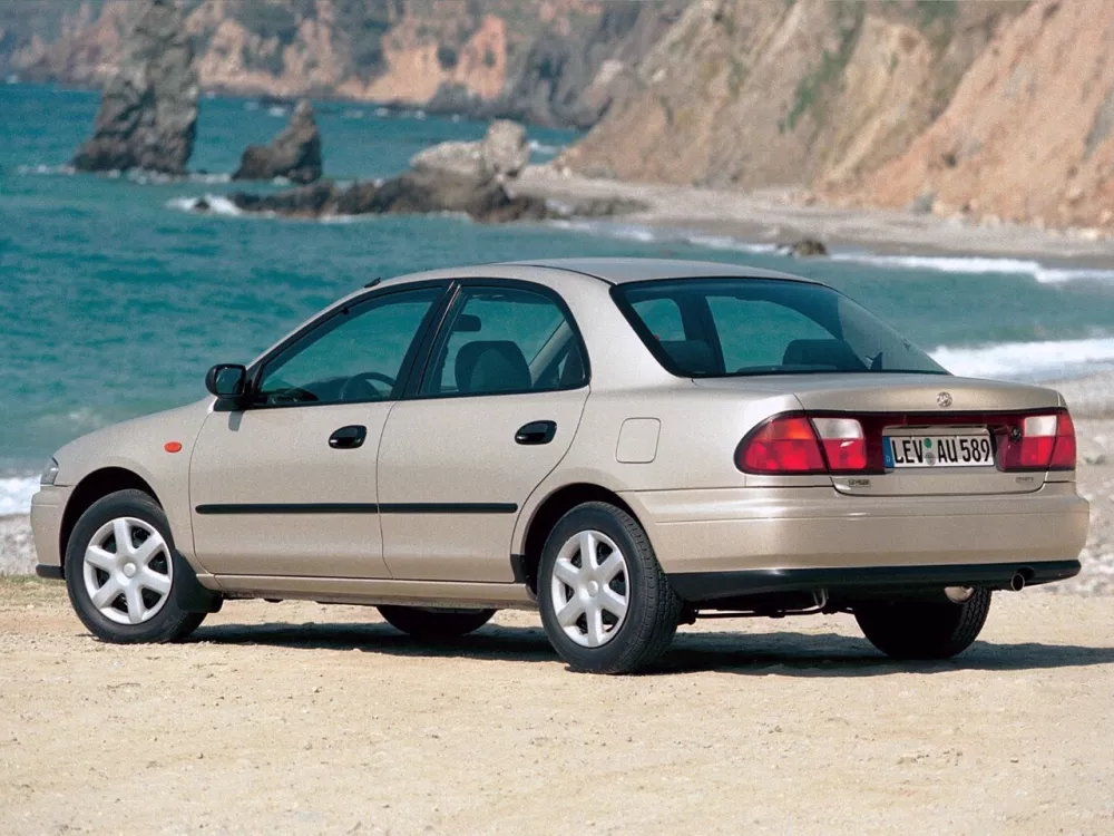 Автомобиль Mazda 323 V (BA) Седан